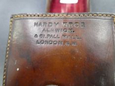 An old Hardy Brothers leather fishing reel case