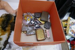 A selection of vintage commercial vehicle badges and vintage tins, etc