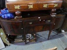 Georgian mahogany bow fronted sideboard having central drawers on square tapered legs
