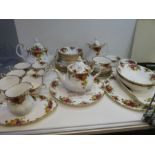 A quantity of Royal Albert Old country Roses, it includes two teapots and a calendar plate '2000'
