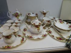 A quantity of Royal Albert Old country Roses, it includes two teapots and a calendar plate '2000'