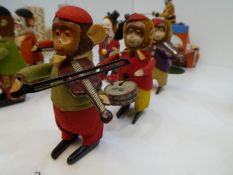 Schuco; Three vintage clockwork monkey musicians