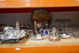 A large selection of silver plate including candlesticks, toast racks, etc