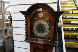 A longcase clock, with key, barley twist and veneered case