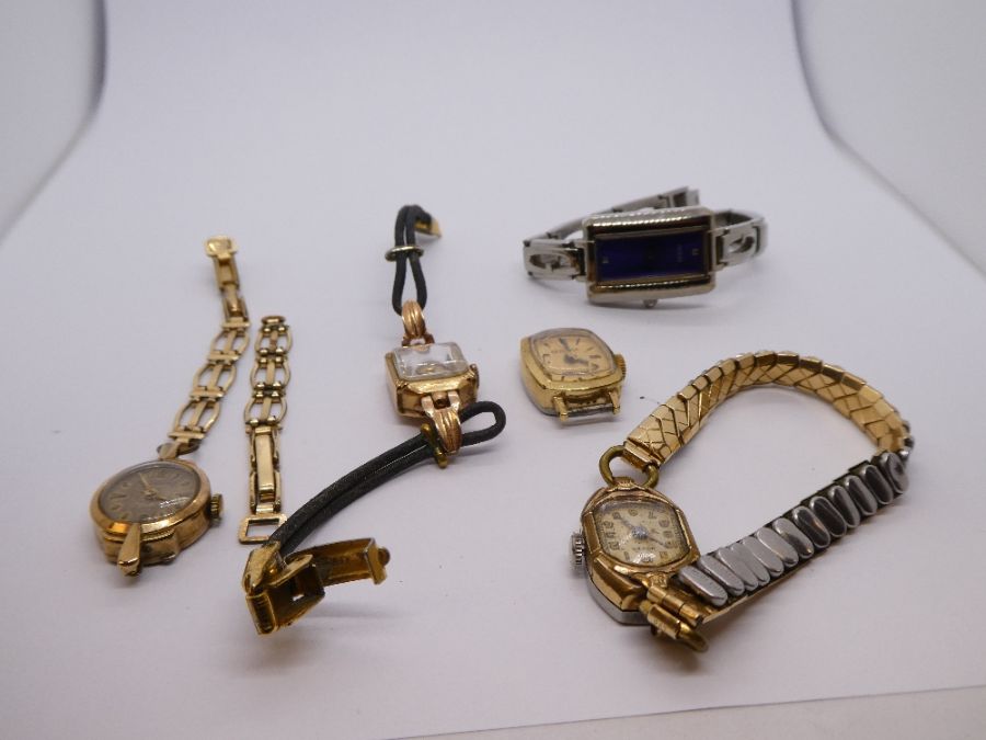 Two small 9ct gold cocktail watches, one with a rolled gold bracelet. Three other watches also i