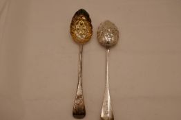 A pair of early Victorian silver gilt heavy berry serving spoons, hallmarked Exeter 1846, Robert Wil