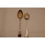 A pair of early Victorian silver gilt heavy berry serving spoons, hallmarked Exeter 1846, Robert Wil