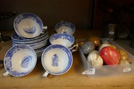 A selection of blue and white Spode cups and saucers and some marble eggs