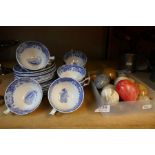 A selection of blue and white Spode cups and saucers and some marble eggs