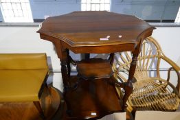 An octagonal two tier occasional table and one other table