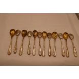A set of twelve silver gilt 800 mustard spoons, marked Vienna Austria 800, 11.38ozt approx