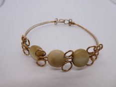 Yellow metal and possible pearl bangle