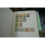 An old stamp album containing Victorian and later examples including GB & Worldwide