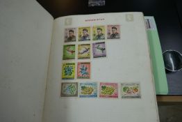 An old stamp album containing Victorian and later examples including GB & Worldwide