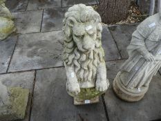 A garden figure of seated Lion holding shield