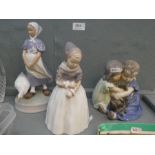 Three Royal Copenhagen figures to include two children hugging dog (3)