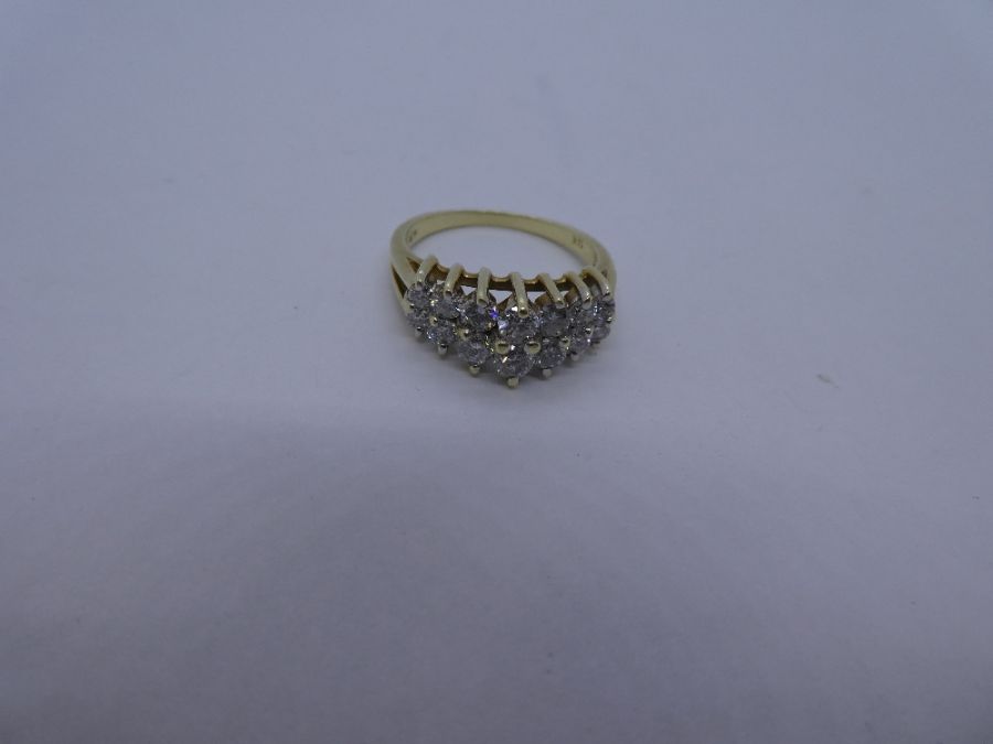 14K yellow gold ring with two raised rows graduating diamonds, marked 14K Size N/O; 4.4g approx - Image 3 of 3