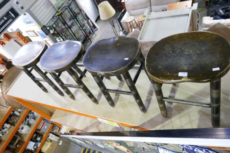 A set of four beech stools, having turned legs