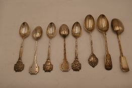 A quantity of silver decorative teaspoons. A set of five miniature Rifle Club Society, look forward