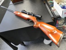 A Weihrauch 5.5 Kal (.22) air rifle with telescope sight and soft case