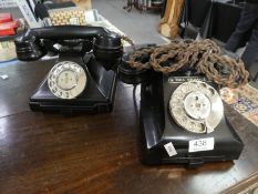 Two vintage Bakelite telephones, both having lower drawer