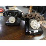 Two vintage Bakelite telephones, both having lower drawer