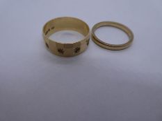 9ct yellow gold wedding band marked 375, together with another wedding band with starburst decoratio