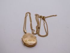 9ct yellow gold neckchain hung with an oval engraved locket, marked 375, 4g approx