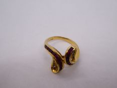 Middle Eastern 18ct gold dress ring, in the form of snake heads, with chanel set rubies and graduate