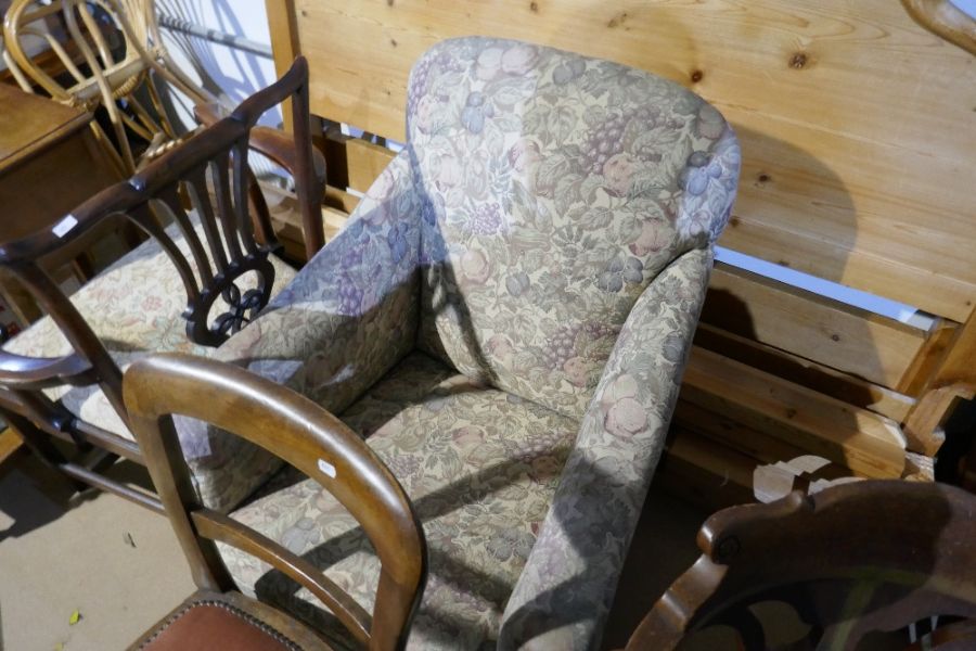 An old armchair on square tapered legs and a pair of mahogany side chairs