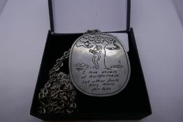 Jorgen Jensen; a large pewter pendant depicting scene form garden of Eden and inscription marked to