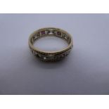 9ct white and yellow gold band ring inset rubies and clear stones, size S, 3.6g approx. Gold content