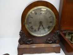 A Victorian walnut mantel clock having carved decoration, 8-day, height 28cms