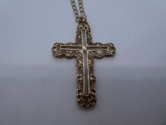 9ct yellow gold curb link necklace marked 375, hung with a large yellow 9ct yellow gold cross. 5 x 3