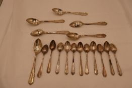 A set of six 800 silver tea spoons with a set of six larger spoons marked 800. Also with four plate