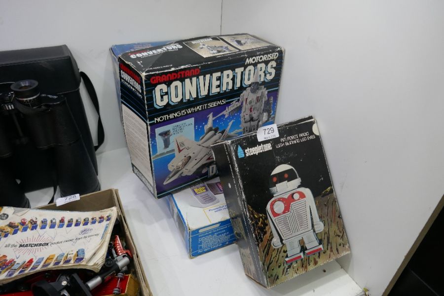 A set of mostly boxed 70s/80s vintage toys and radios in the form of spacecraft
