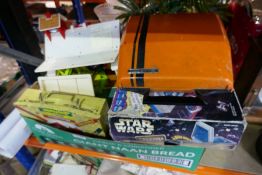 Box containing vintage toys and games include Fisher Price farm, lunch box, Star Wars games, movie p