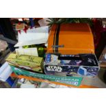 Box containing vintage toys and games include Fisher Price farm, lunch box, Star Wars games, movie p