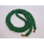String of green hardstone beads, screw catch, character marks, 77cm