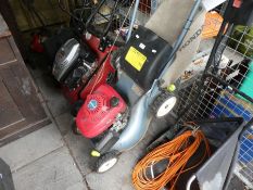 A Honda petrol lawn mower and an electric example