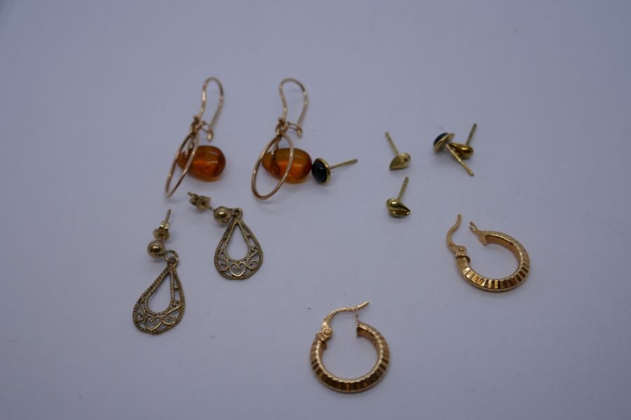 Collection 9ct and yellow metal earrings including hoops, drop examples, set amber coloured stones,