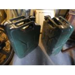 A pair of green painted jerry cans