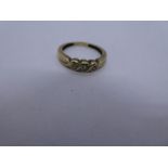 15ct yellow gold diamond set trilogy ring, size K, 1.8g approx, marked 15ct DIA. Gold content value
