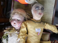 A Victorian Armand Marseille bisque head doll and one other antique doll having cloth head