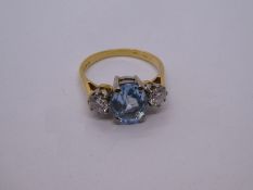 18ct yellow gold aquamarine and diamond trilogy ring, central oval aquamarine 8.5mm x 6.9mm, flanked