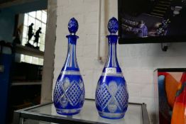 A pair of Bohemian blue and clear glass decanters