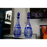 A pair of Bohemian blue and clear glass decanters