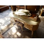 A painted kidney shape dressing table with triple mirror and sundry