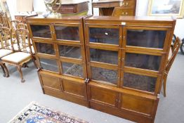 A pair of mid 20th century Globe Wernicke style book cases having glazed doors and cupboards under,