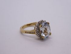 10K aquamarine and diamond cluster ring with large chequerboard aquamarine surrounded by 14 small di